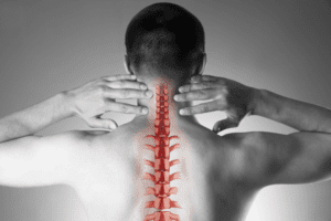 Image with the back of a man and spinal cord representation