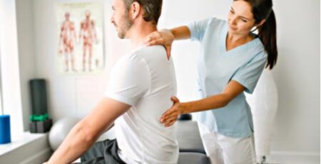 Young man getting chiropractic care for muscle strains