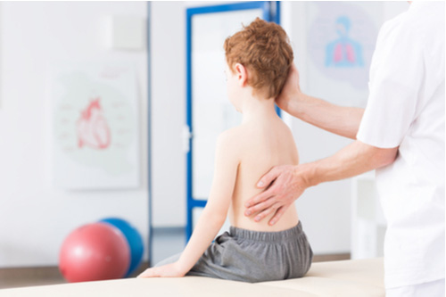 Pompano Beach scoliosis treatment little boy at physiotherapy