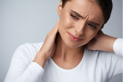 Deerfield Beach neck injury treatment concept young woman with neck pain