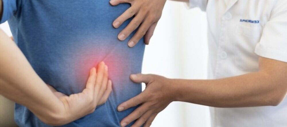 Chiropractor Diagnosing Patients Back Pain