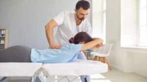 Woman Having Chiropractic Back Adjustment Osteopath